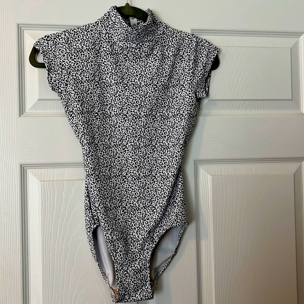 Eleve high-neck, open back leotard